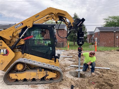 micro piling skid steer through|anchor drives for piles.